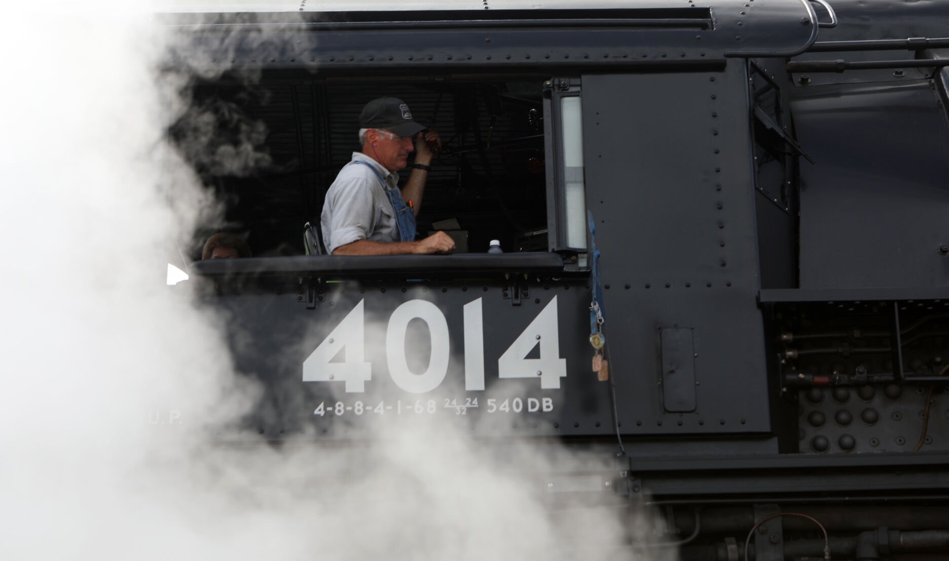 No. 4014's conductor sits in the locomotive